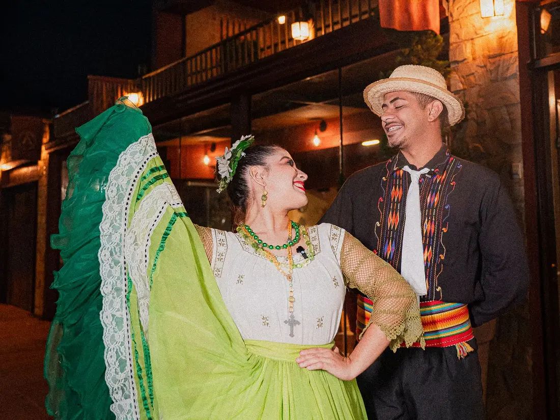 Dancers in traditional Paraguayan dress at the Hoplon Club at night